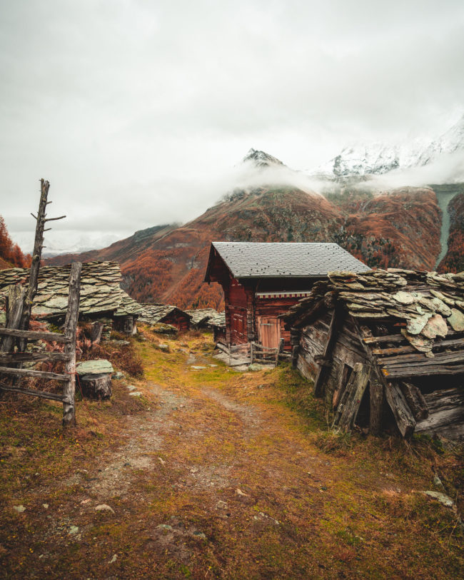 a little village nearby a blue lake in switzerland