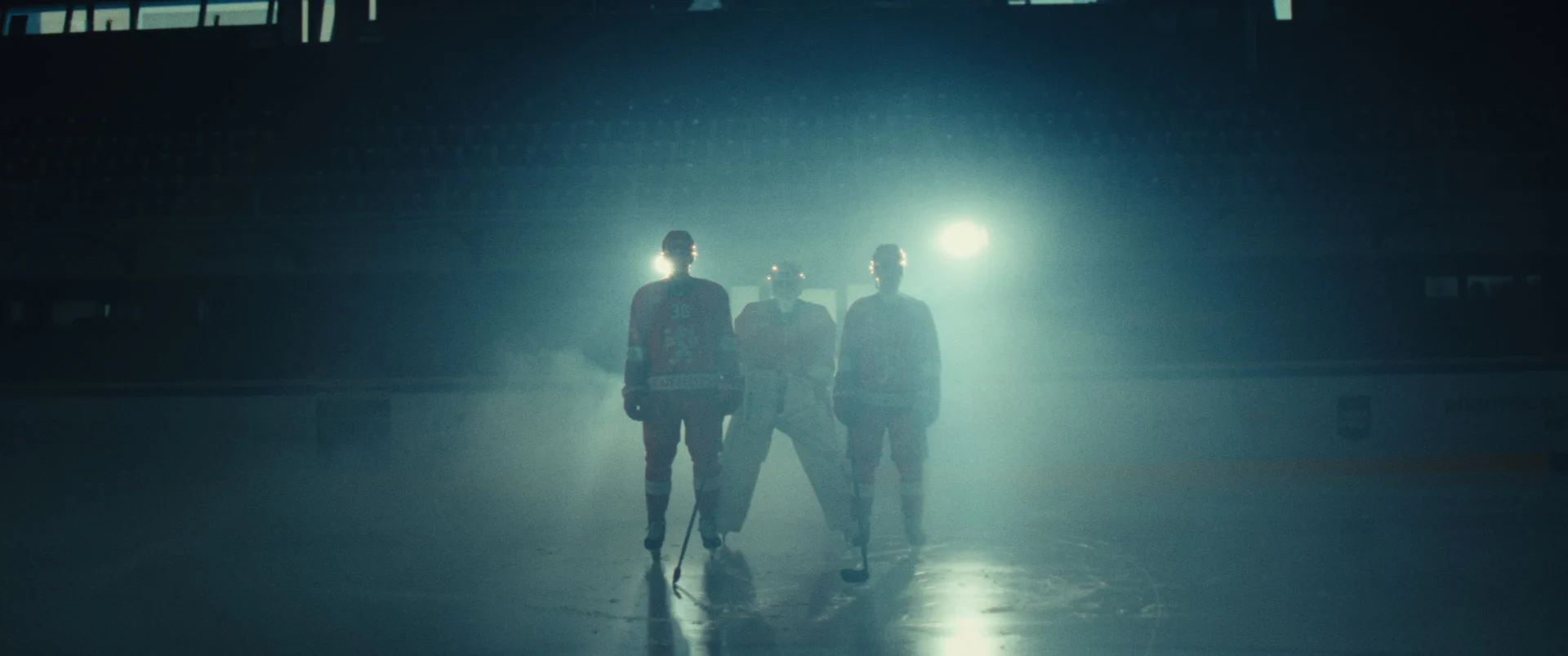 Hockey players standing in cinematic haze during a branded content commercial with dramatic lighting and atmosphere