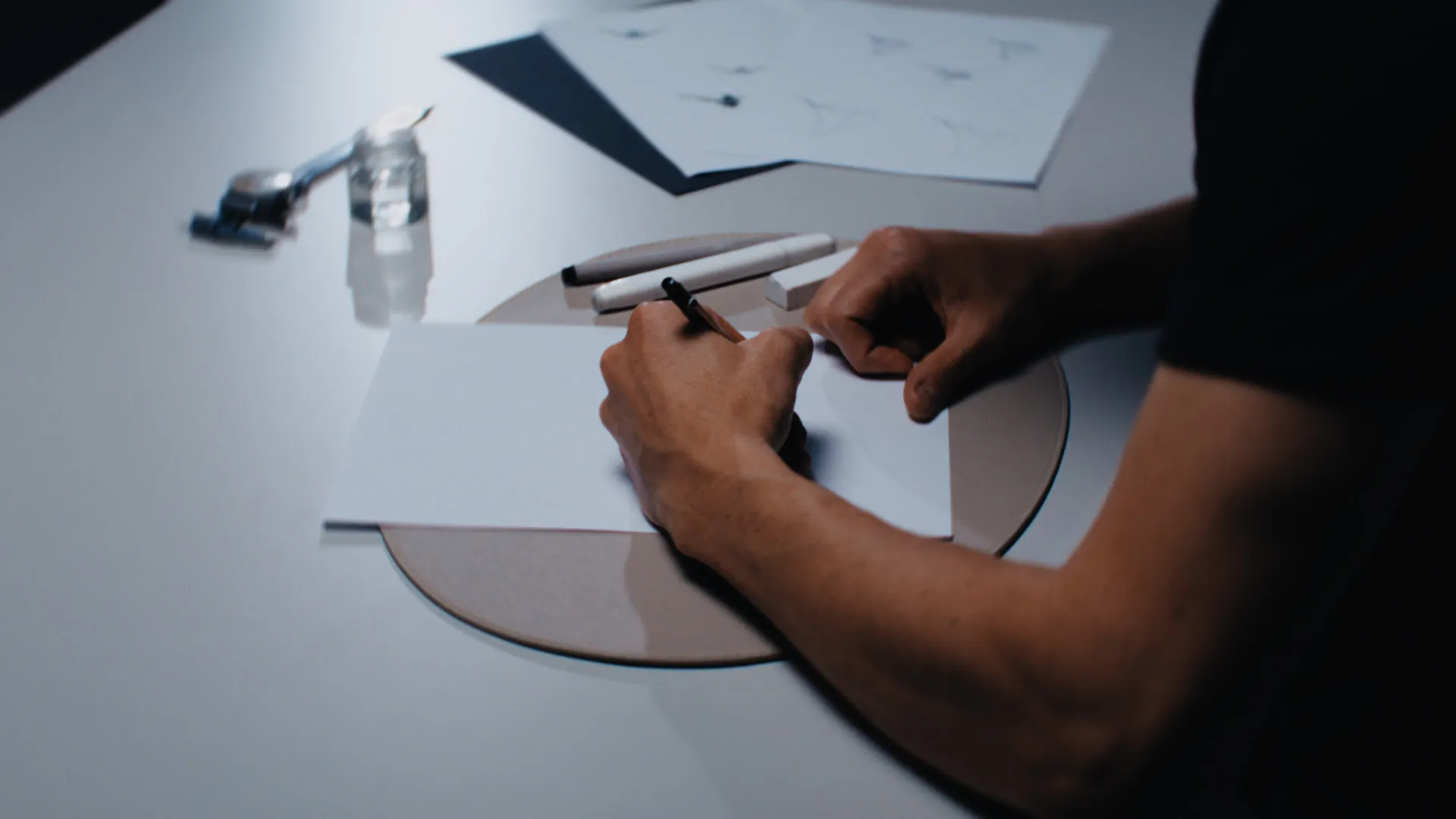 Close-up of hands sketching a design for a commercial branded content film about Swiss craft and precision