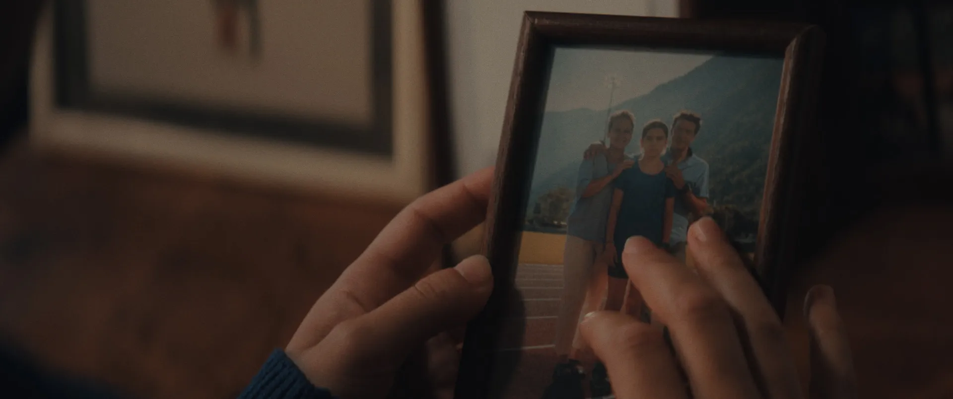 Close-up of a framed photo used in a narrative commercial to build emotional storytelling and character backstory