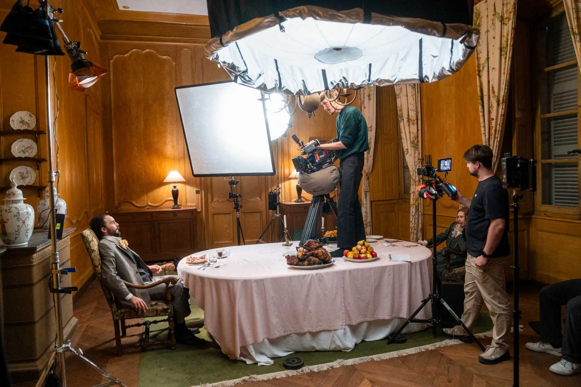 Film crew working on set during a commercial production timeline.